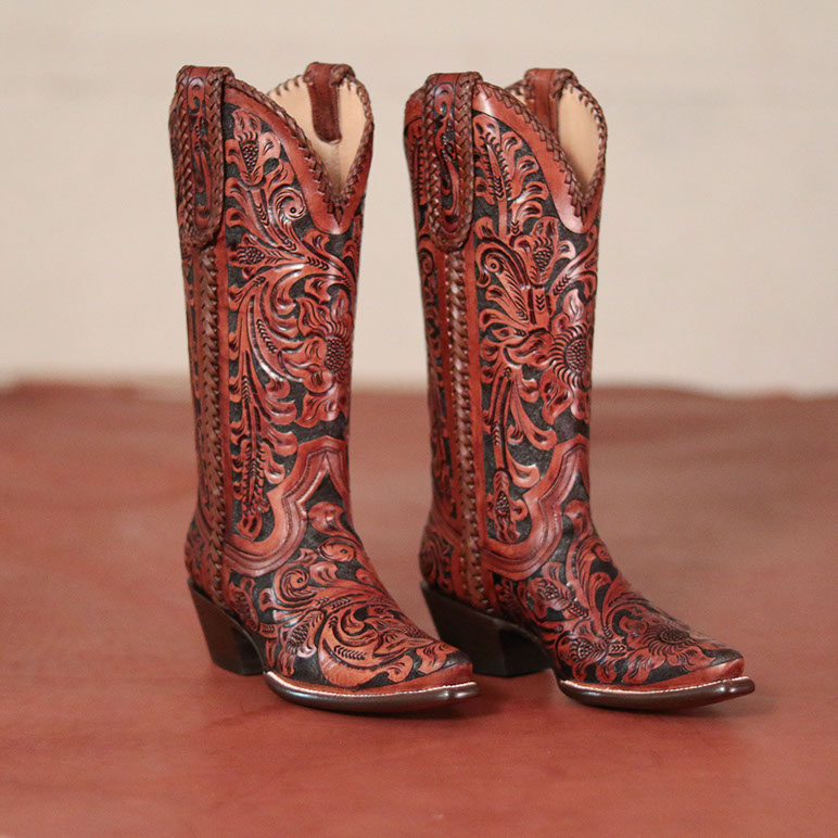 A pair of Leddy Vaquero boots with hand-tooled floral tops